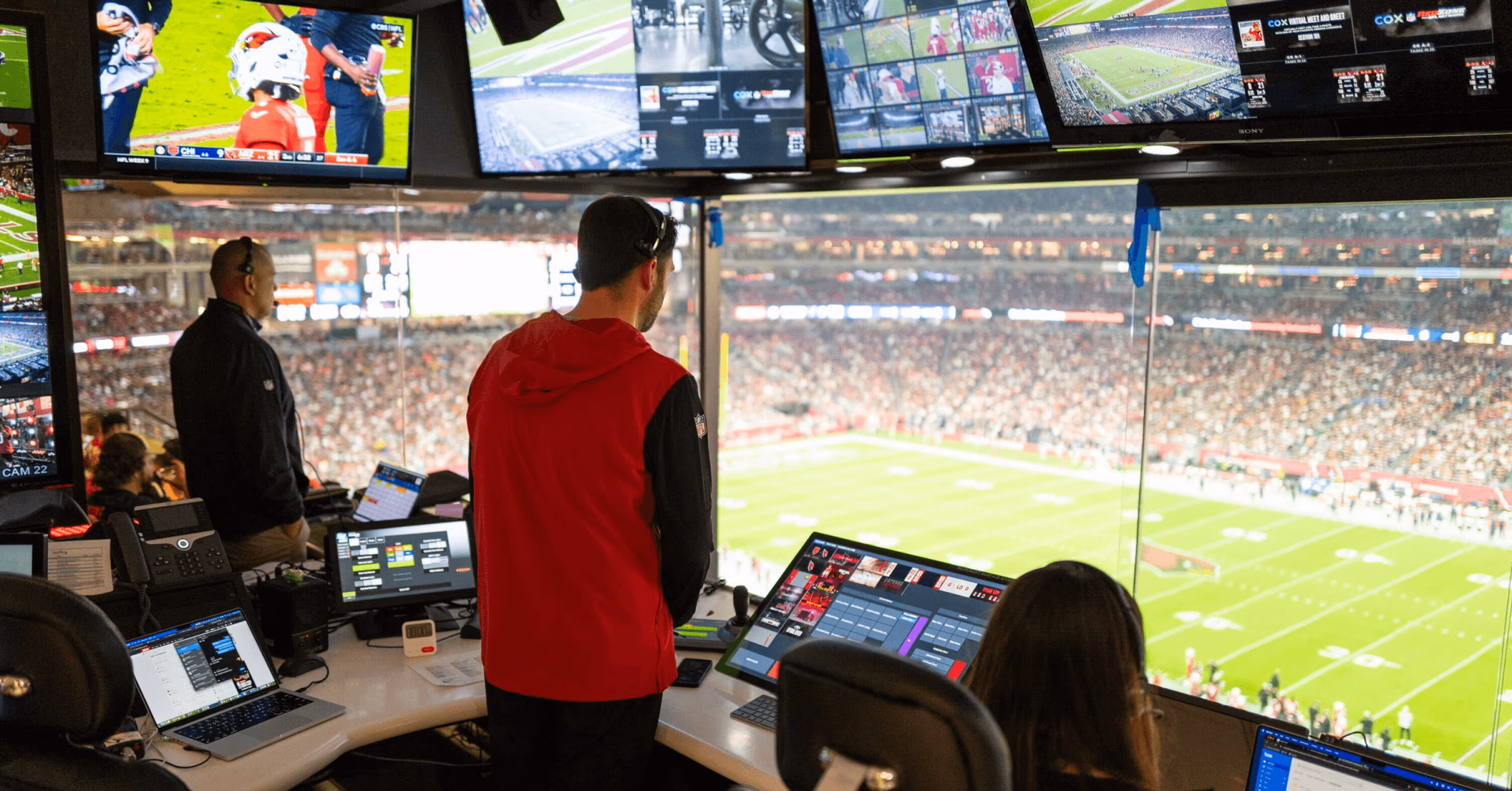 BIG Creative team behind the scenes at a football game.