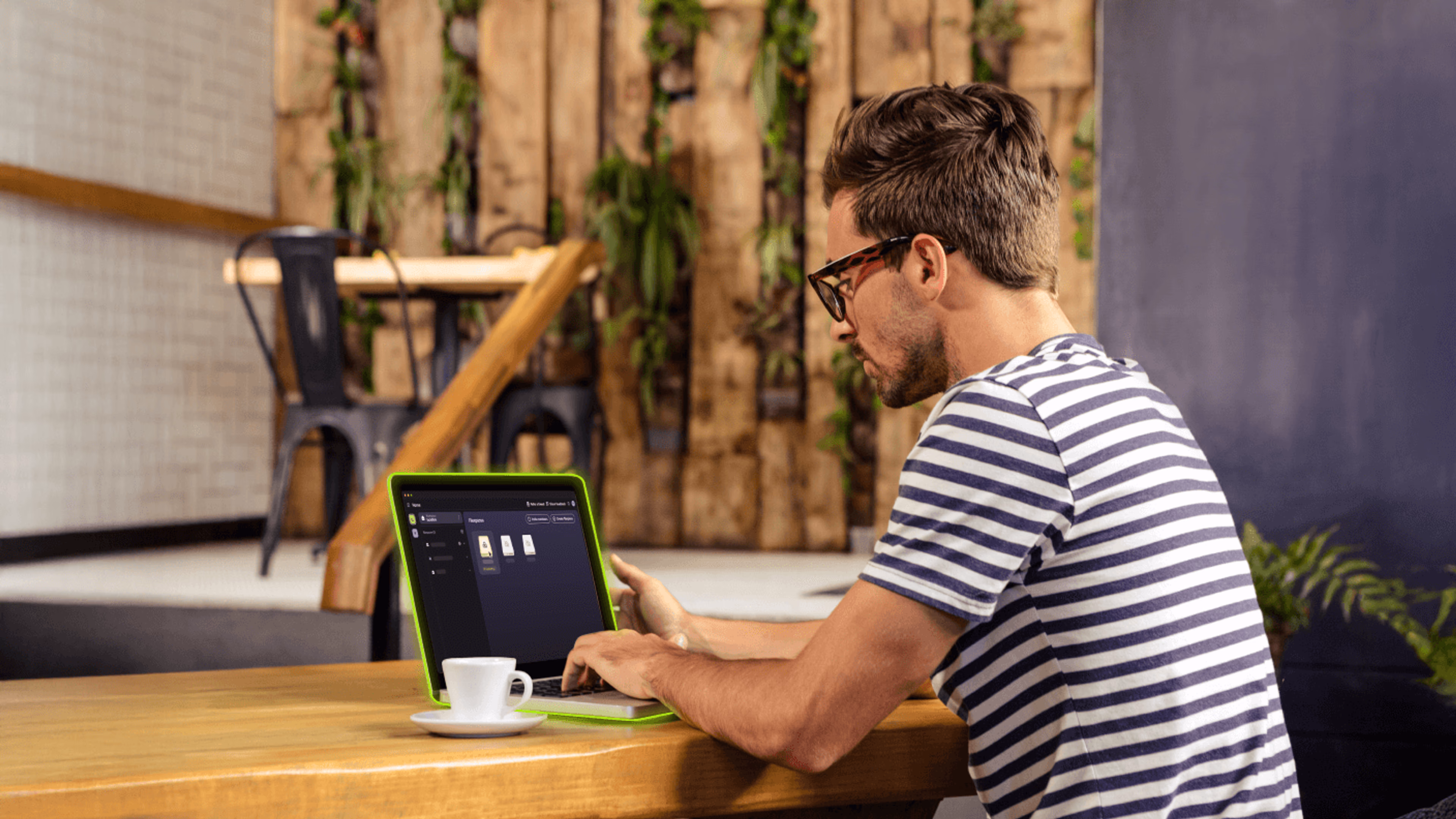 An engineer on a laptop collaborating on an AEC project through LucidLink.