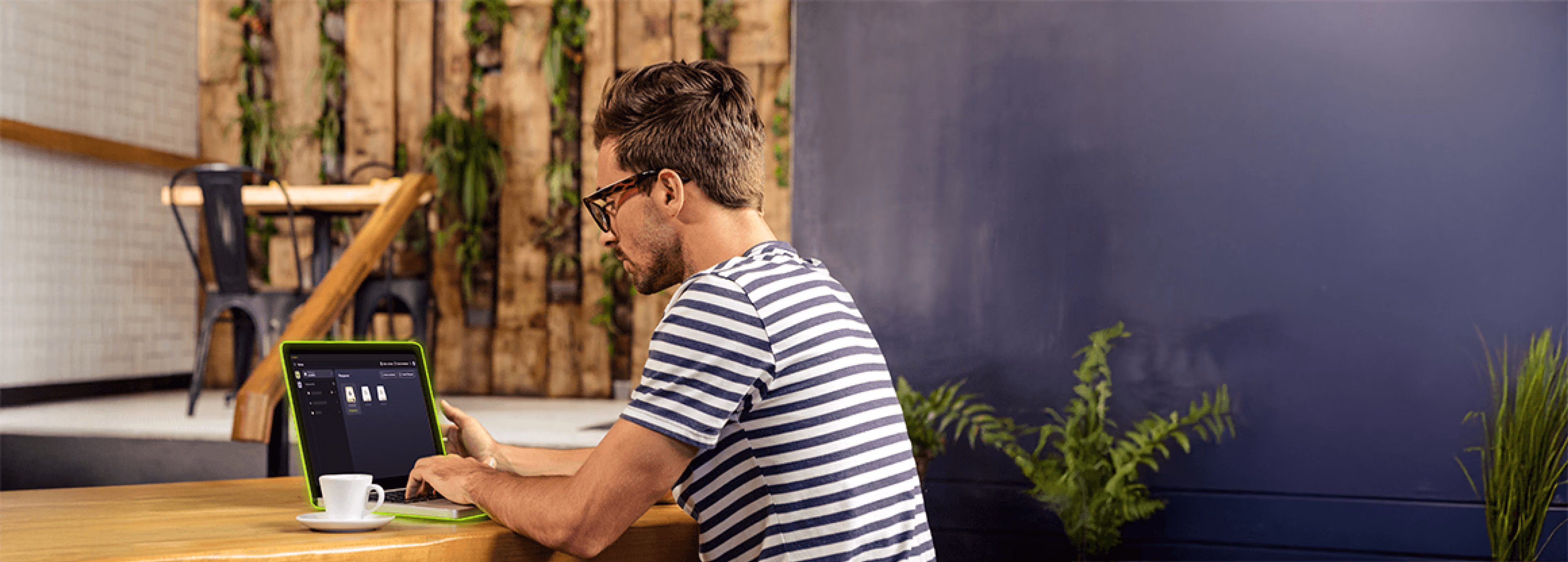 An engineer on a laptop collaborating on an AEC project through LucidLink.