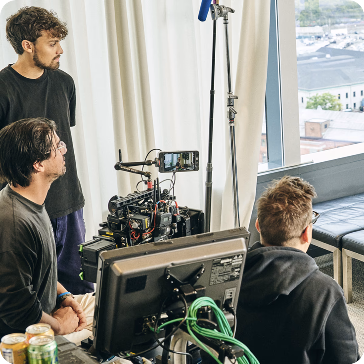 A team of three on a live broadcasting set.