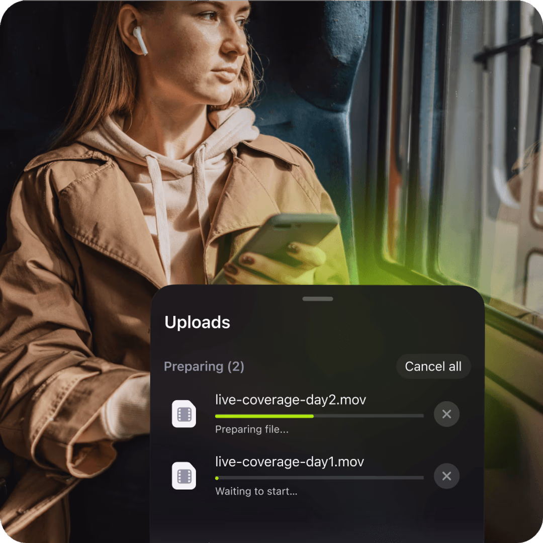 A woman on a train holding a phone, overlaid with a mobile app UI showing video files uploading to the cloud.